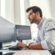 Business person checking charts on computer