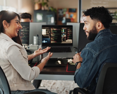 Tech Professional helping business owner with computer