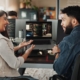 Tech Professional helping business owner with computer