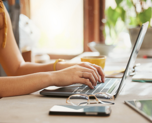 Computer, woman hands and online working of a remote employee with code work at home